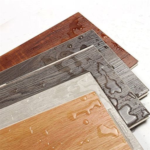 waterproof spc flooring samples with wood grain patterns and water droplets